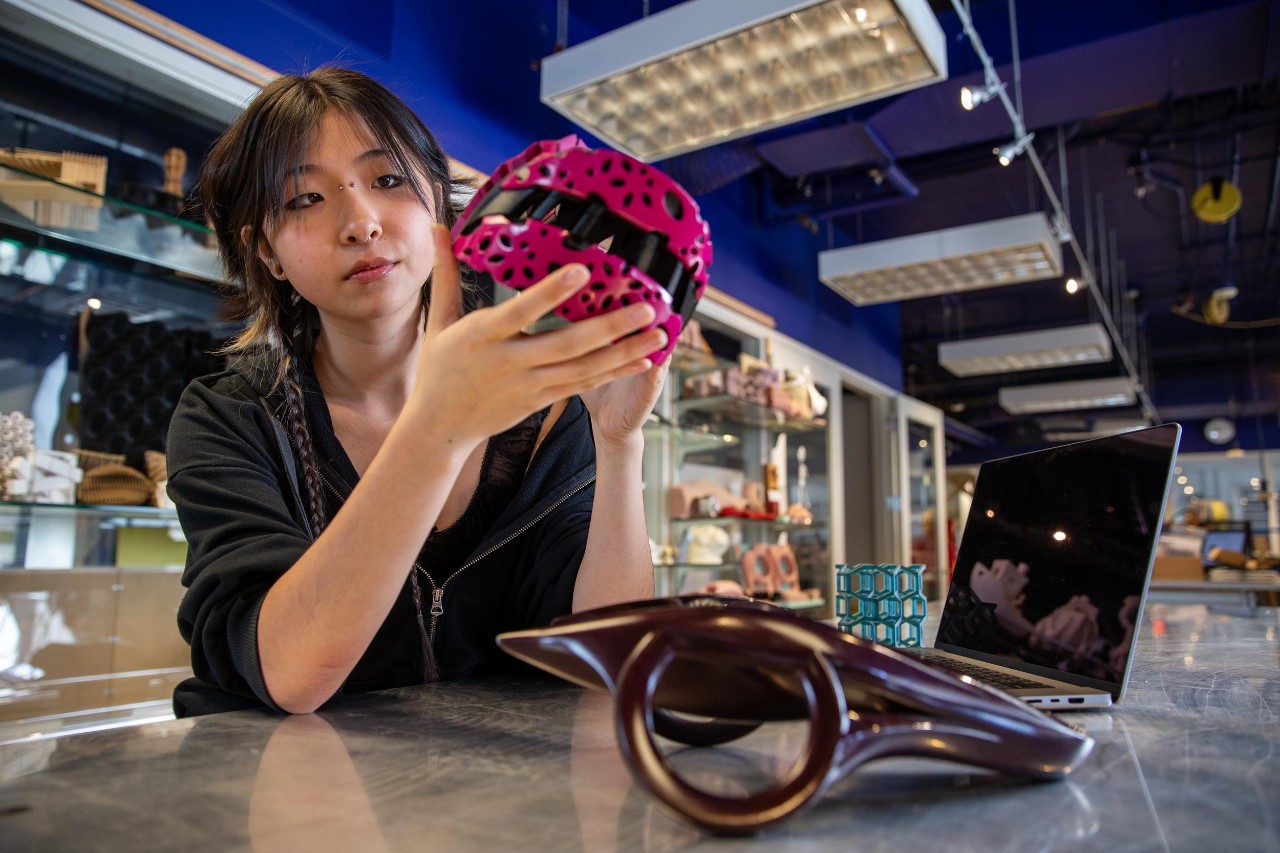 A University of Cincinnati Co-op student works on a model