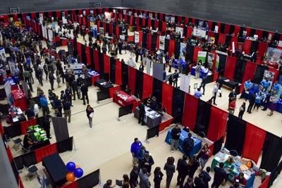 overhead view of people mingling at booths